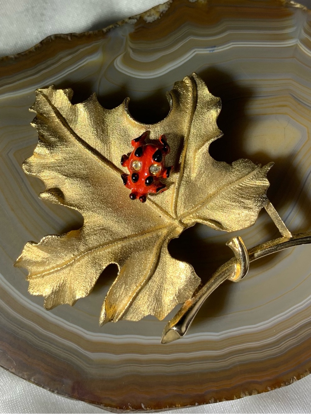 Sarah Coventry Gold Leaf Brooch with Red and Black Enamel Ladybug